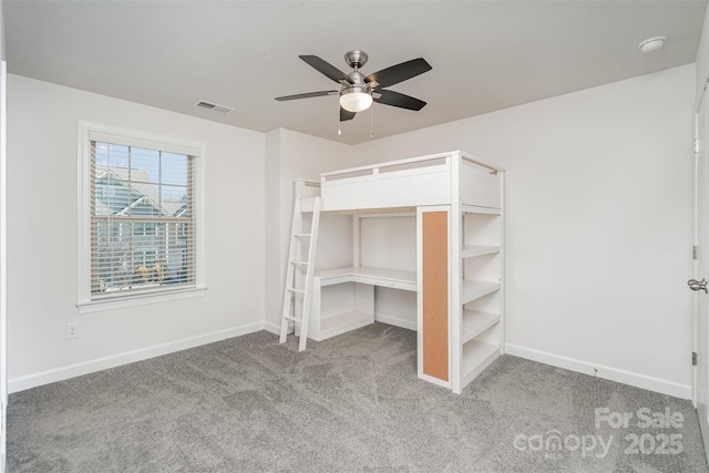 unfurnished bedroom featuring light colored carpet and ceiling fan