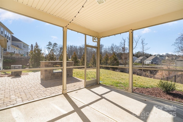 unfurnished sunroom featuring plenty of natural light