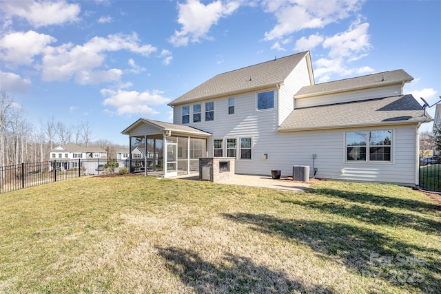 back of house with a patio, a sunroom, a yard, and central air condition unit