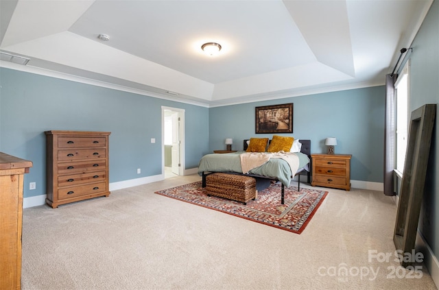 carpeted bedroom with a raised ceiling and multiple windows