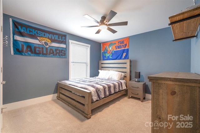 bedroom featuring ceiling fan and light colored carpet