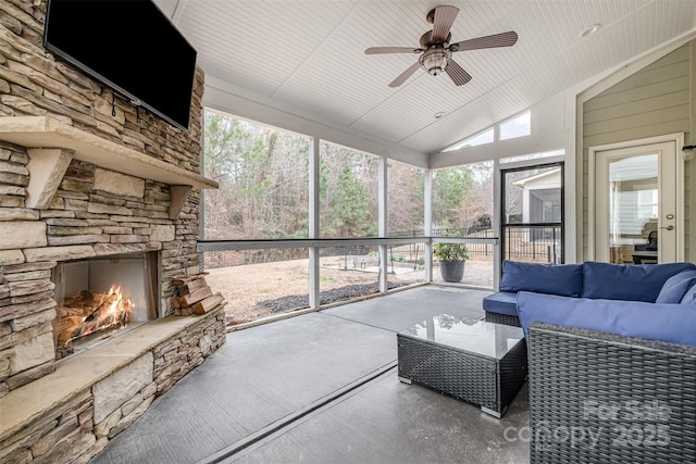 2201 Bluebell Way, Tega Cay, SC 29708 - sunroom / solarium with vaulted ceiling, a ceiling fan, and an outdoor living space with a fireplace