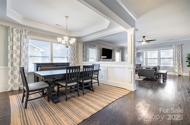 2201 Bluebell Way, Tega Cay, SC 29708 - dining area featuring decorative columns, dark wood finished floors, ornamental molding, a chandelier, and a ceiling fan
