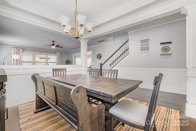 2201 Bluebell Way, Tega Cay, SC 29708 - dining area with crown molding, ceiling fan, wood finished floors, a chandelier, and decorative columns