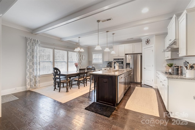 2201 Bluebell Way, Tega Cay, SC 29708 - kitchen featuring stainless steel fridge, under cabinet range hood, dishwasher, backsplash, and beam ceiling