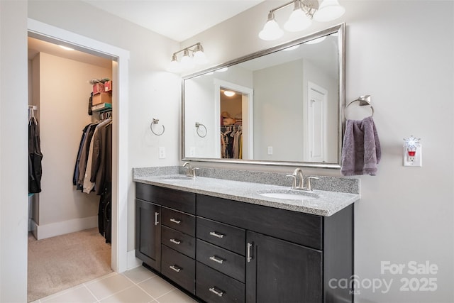 2201 Bluebell Way, Tega Cay, SC 29708 - full bathroom with double vanity, a walk in closet, tile patterned flooring, and baseboards