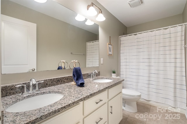 2201 Bluebell Way, Tega Cay, SC 29708 - full bath with tile patterned flooring, toilet, double vanity, and curtained shower
