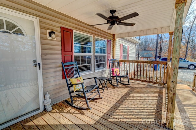 deck with ceiling fan and a porch