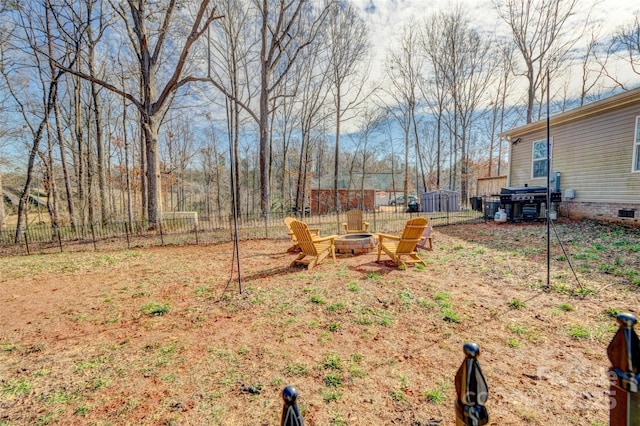 view of yard featuring a fire pit