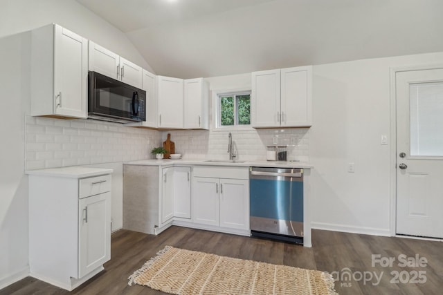 211 Brooklyn Ave, Lancaster, SC 29720 - kitchen with dishwashing machine, a sink, black microwave, dark wood-style flooring, and vaulted ceiling