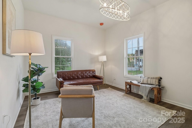 211 Brooklyn Ave, Lancaster, SC 29720 - living room featuring wood finished floors, baseboards, and a chandelier