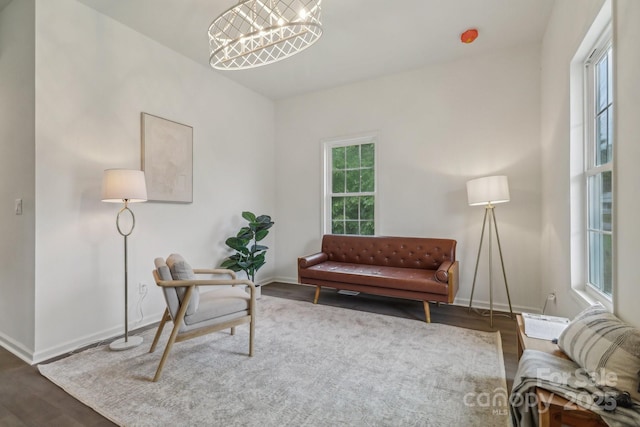 211 Brooklyn Ave, Lancaster, SC 29720 - sitting room featuring wood finished floors, baseboards, and a chandelier