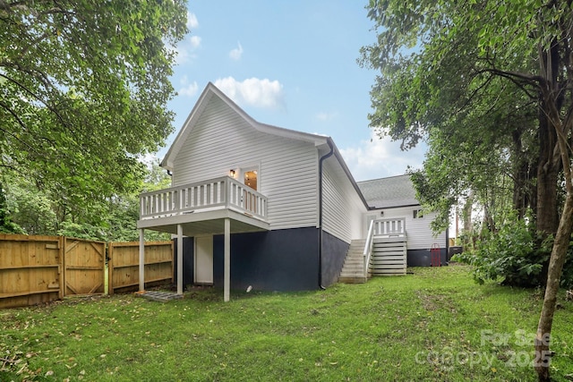 211 Brooklyn Ave, Lancaster, SC 29720 - rear view of house with a gate and a wooden deck