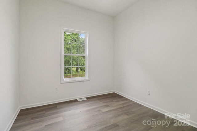211 Brooklyn Ave, Lancaster, SC 29720 - unfurnished room with dark wood-style flooring and baseboards