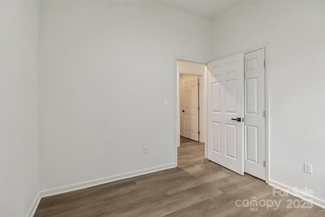 211 Brooklyn Ave, Lancaster, SC 29720 - unfurnished bedroom featuring wood finished floors and baseboards