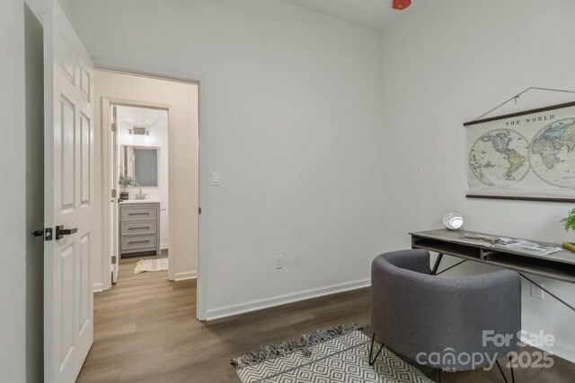211 Brooklyn Ave, Lancaster, SC 29720 - home office with dark wood-type flooring, baseboards, and a sink