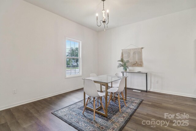 211 Brooklyn Ave, Lancaster, SC 29720 - dining area with wood finished floors, a chandelier, and baseboards