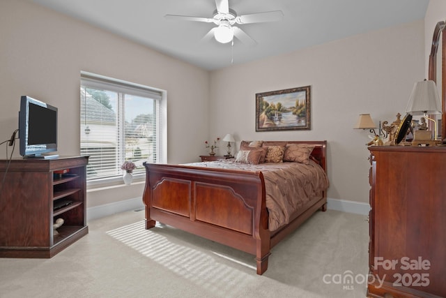 bedroom with light colored carpet and ceiling fan