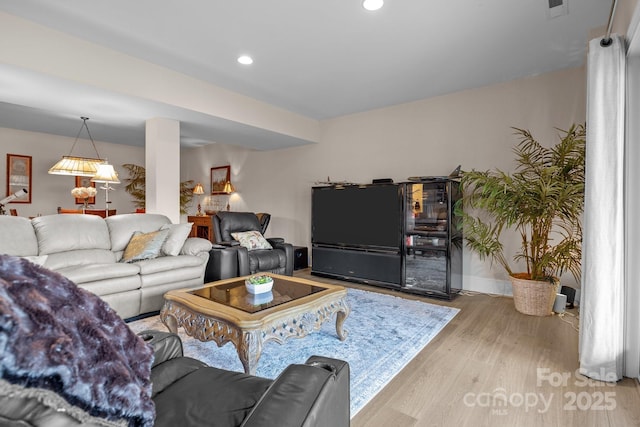 living room with light hardwood / wood-style floors