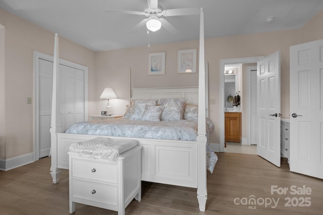 bedroom with hardwood / wood-style flooring, ensuite bath, and ceiling fan