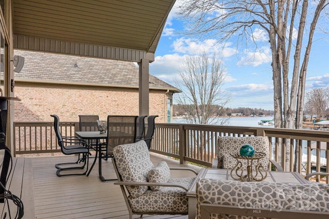 wooden deck with a water view