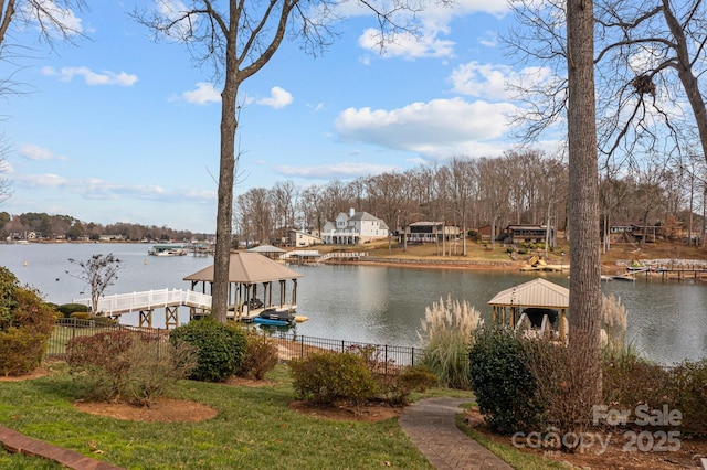 view of dock featuring a gazebo and a water view