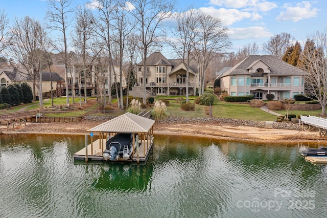 view of dock featuring a yard, a balcony, and a water view