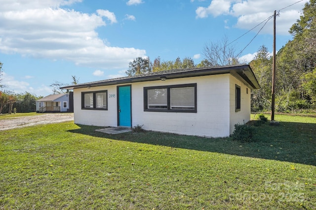 ranch-style house with a front lawn