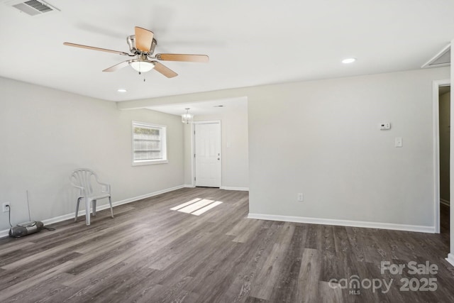 unfurnished room with dark hardwood / wood-style flooring and ceiling fan