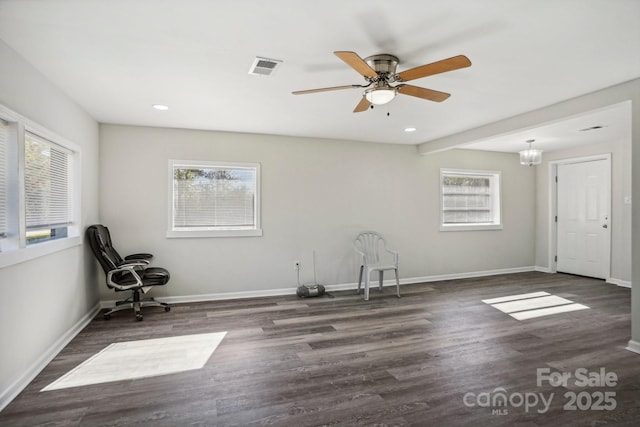 interior space with dark wood-type flooring and ceiling fan