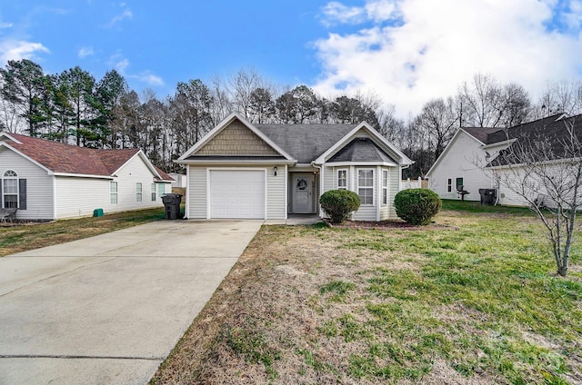 view of front of property featuring a garage and a front yard