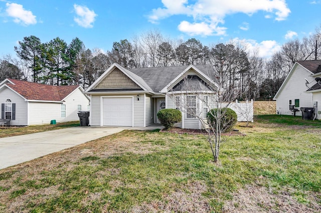 view of front of home featuring a garage and a front lawn