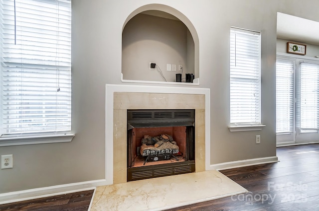 interior details with hardwood / wood-style flooring and a fireplace