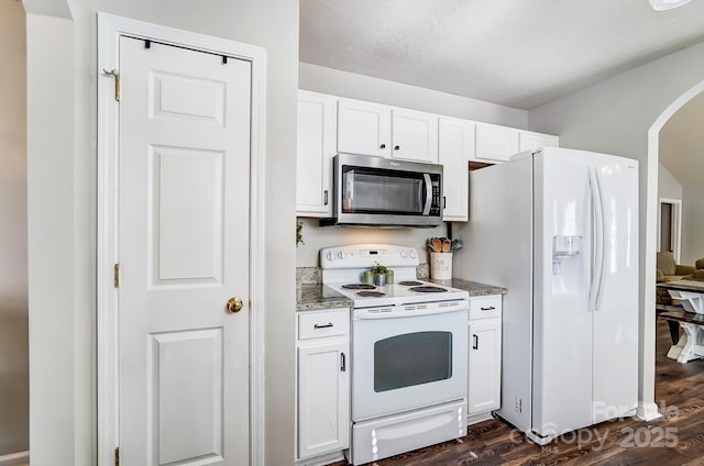 kitchen featuring white cabinetry, stone countertops, a textured ceiling, dark hardwood / wood-style floors, and white appliances