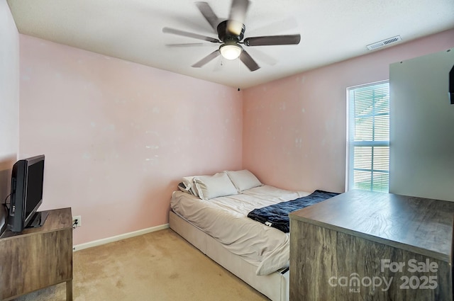 carpeted bedroom with ceiling fan