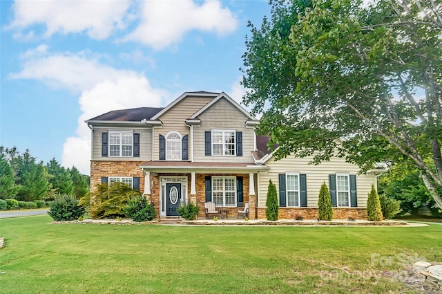 craftsman-style house featuring a porch and a front lawn