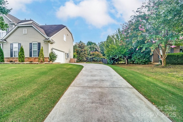 view of property exterior featuring a garage and a lawn