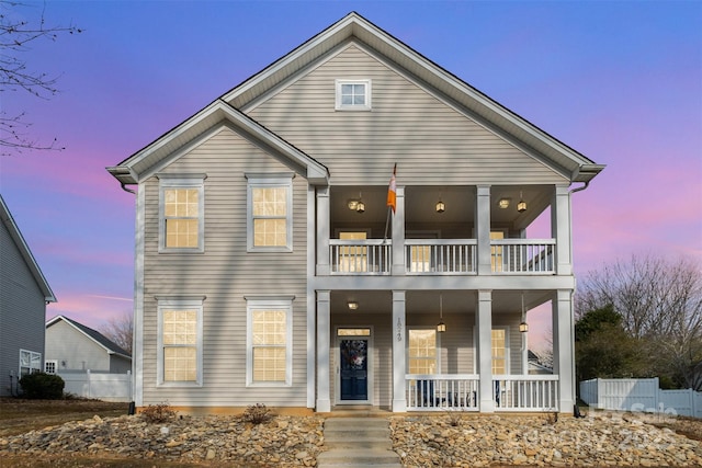 view of front of home with a porch and a balcony