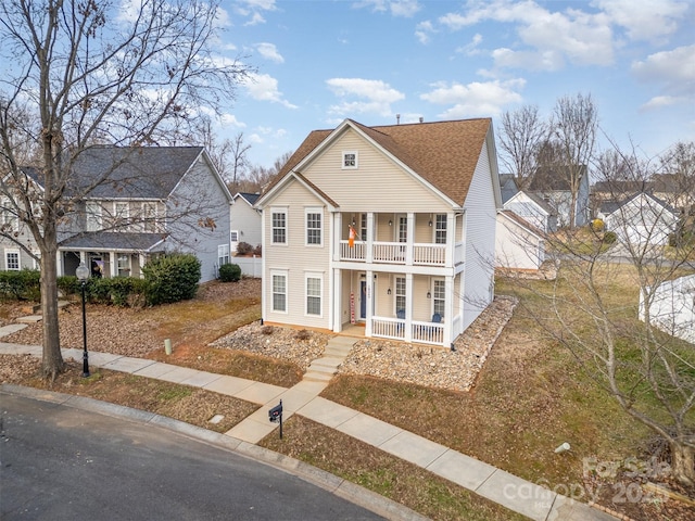 view of front of home with a balcony and covered porch