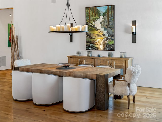dining area with hardwood / wood-style floors