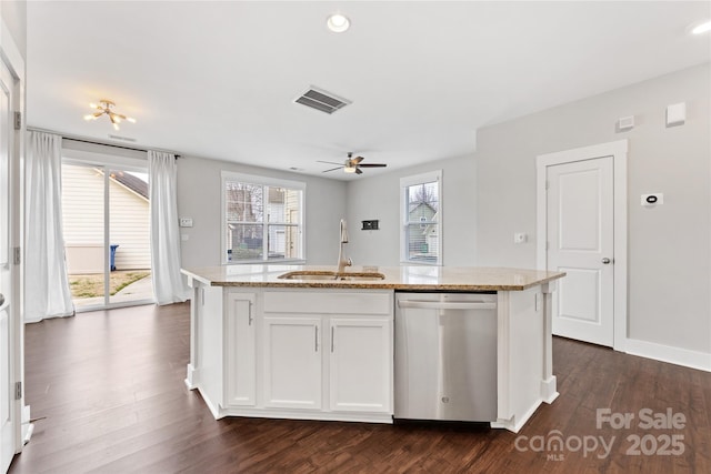 kitchen with sink, white cabinets, a kitchen island with sink, stainless steel dishwasher, and light stone countertops