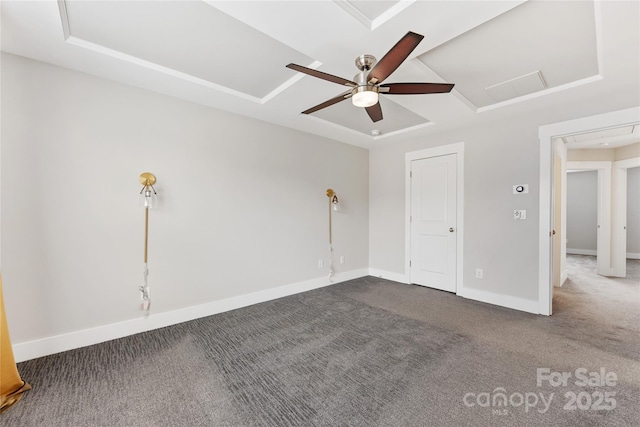 unfurnished bedroom with dark carpet and ceiling fan