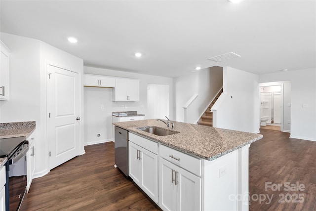 kitchen featuring sink, white cabinetry, a center island with sink, stainless steel dishwasher, and light stone countertops