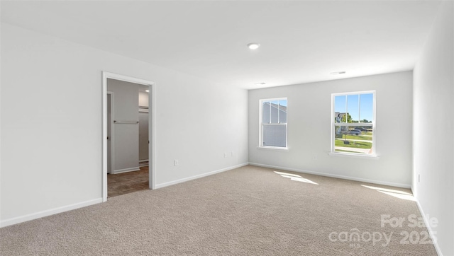 spare room featuring carpet flooring