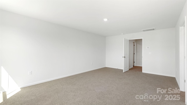 empty room featuring carpet flooring