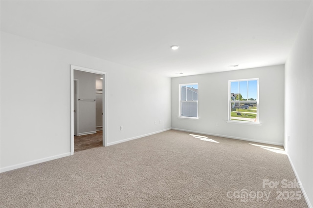 unfurnished room featuring carpet