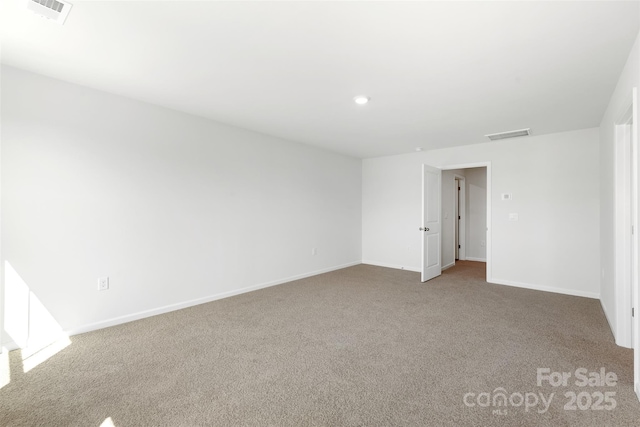 unfurnished room with carpet floors