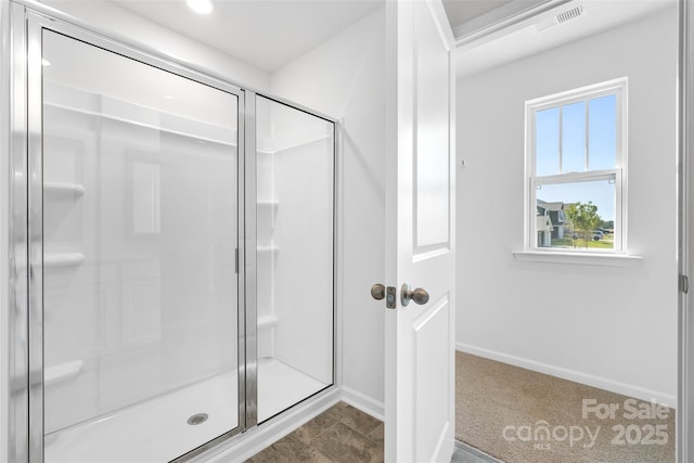 bathroom with a shower with shower door