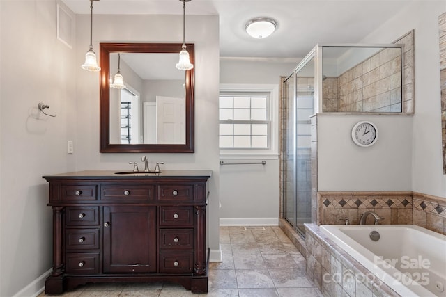 bathroom featuring vanity, shower with separate bathtub, and tile patterned flooring