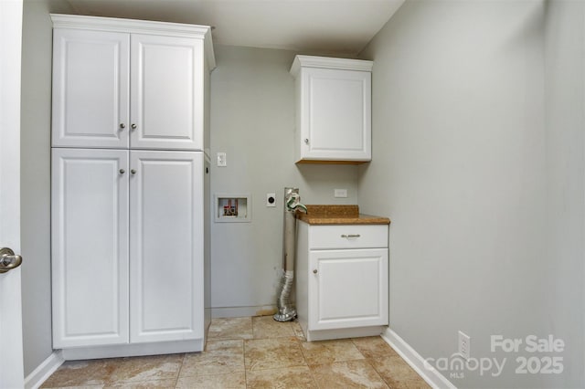 laundry area with cabinets, hookup for a washing machine, and electric dryer hookup